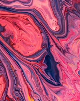 Apple-inspired watch face featuring a vibrant swirl design in pink, purple, and blue tones