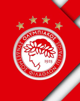 The Olympiacos emblem in red and white with gold stars above, set on a bold red background, featured on a watch face.