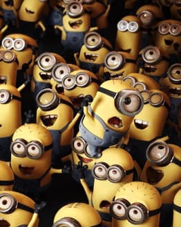 A vibrant illustration of a crowd of Minions with various expressions, featured on a watch face.