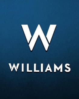 A watch face featuring the Williams Racing "W" logo on a dark blue background.