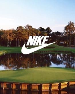 Scenic golf course with a water hazard and the Nike logo, surrounded by trees and open skies, displayed on a watch face.