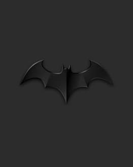 Batman emblem watch face displaying a 3D bat symbol on a sleek, dark grey background.