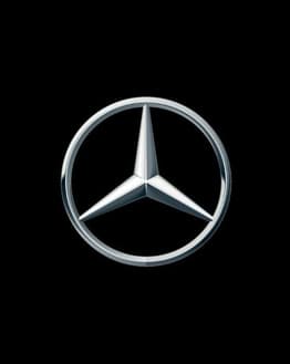 Mercedes-Benz logo with the three-pointed star emblem on a black background, featured on a luxury watch face.