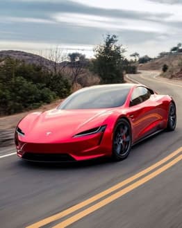 Tesla Roadster in bold red speeding through scenic canyon roads, designed as a watch face
