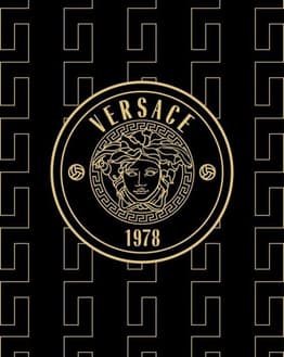 A luxurious black and gold design featuring the Versace Medusa emblem and Greek key pattern, symbolizing high fashion and sophistication, featured on a watch face.