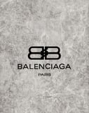 Balenciaga Paris logo over a gray marble-textured background, featured on a watch face