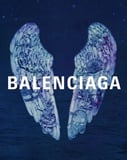 Balenciaga logo with artistic angel wings on a night sky background, featured on a watch face