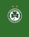 The Omonia Nicosia crest featuring a cloverleaf, the year 1948, and two gold stars, set against a bold green background, featured on a watch face.