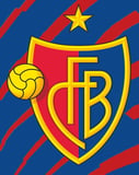 The FC Basel crest with a yellow star, golden football, and red and blue shield design, set against a dynamic striped background, featured on a watch face.