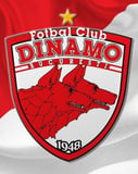 The Dinamo București crest with two red wolves, the year 1948, and a golden star, set against a red and white background, featured on a watch face.