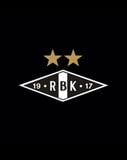 Rosenborg BK logo featuring the RBK crest with gold stars above, set on a black background, displayed on a watch face