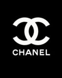 Coco Chanel interlocking "CC" logo in black and white, displayed on a watch face