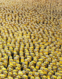 A massive crowd of Minions wearing goggles and blue overalls, with varied expressions, creating a lively and chaotic design on a watch face.