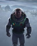 Illustration of Buzz Lightyear in his space suit, walking confidently on a futuristic sci-fi base, featured on a watch face.