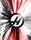 A watch face featuring the Haas Formula 1 logo with dynamic red, black, and white streaks in the background.