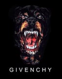 A watch face featuring the iconic Givenchy snarling Rottweiler design on a sleek black background.