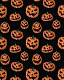 Seamless pattern of carved Jack-o’-Lantern pumpkins with glowing expressions on a black background, displayed on a watch face.