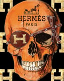 Hermès-inspired Apple Watch face featuring a bold skull design with gold accents and iconic branding