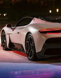 Supercar rear view watch face displaying the back of a sleek luxury supercar under street lighting, emphasizing speed and style.