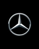 Mercedes-Benz logo with the three-pointed star emblem on a black background, featured on a luxury watch face.