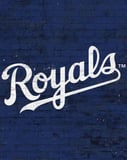 Kansas City Royals watch face displaying the team’s logo in white against a textured blue brick background.
