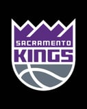 Sacramento Kings logo featuring a purple and silver crown with a basketball design, displayed on a watch face.