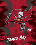 Tampa Bay Buccaneers flag logo with a skull and football, set against a bold red and black background, featured on a watch face.