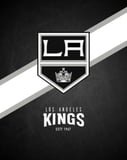 Los Angeles Kings logo with a dark background and silver-and-white diagonal stripes, featured on a watch face.