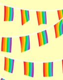 Colorful rainbow flag bunting on a soft pastel background, featured on a watch face.
