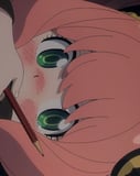 Close-up illustration of a pink-haired anime girl with wide green eyes and blushing cheeks, looking upside down with a pencil near her face, featured on a watch face.