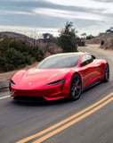 Tesla Roadster in bold red speeding through scenic canyon roads, designed as a watch face