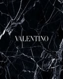 Elegant black marble texture with white veins and Valentino typography, creating a luxurious and minimalist aesthetic, featured on a watch face.
