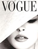 Black-and-white portrait of a glamorous woman wearing a wide-brimmed hat with Vogue typography, designed as a stylish watch face